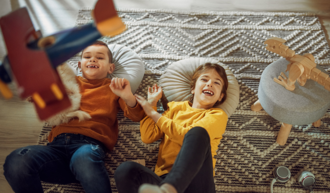 Children lying down on a rug